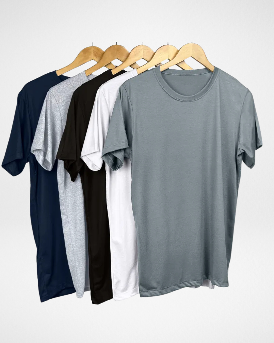 5-pack of men’s cool knit t-shirts in assorted colors; breathable lightweight t-shirts for men; front view of men’s crew neck cool knit tee; soft and quick-drying polyester-viscose shirts for summer; close-up of malha fria fabric texture; relaxed fit men’s t-shirts with classic neckline; black, white, navy, grey, and red men’s t-shirt set; everyday performance t-shirts for warm weather; men’s essential t-shirt bundle with breathable fabric; durable and fade-resistant malha fria t-shirts for men