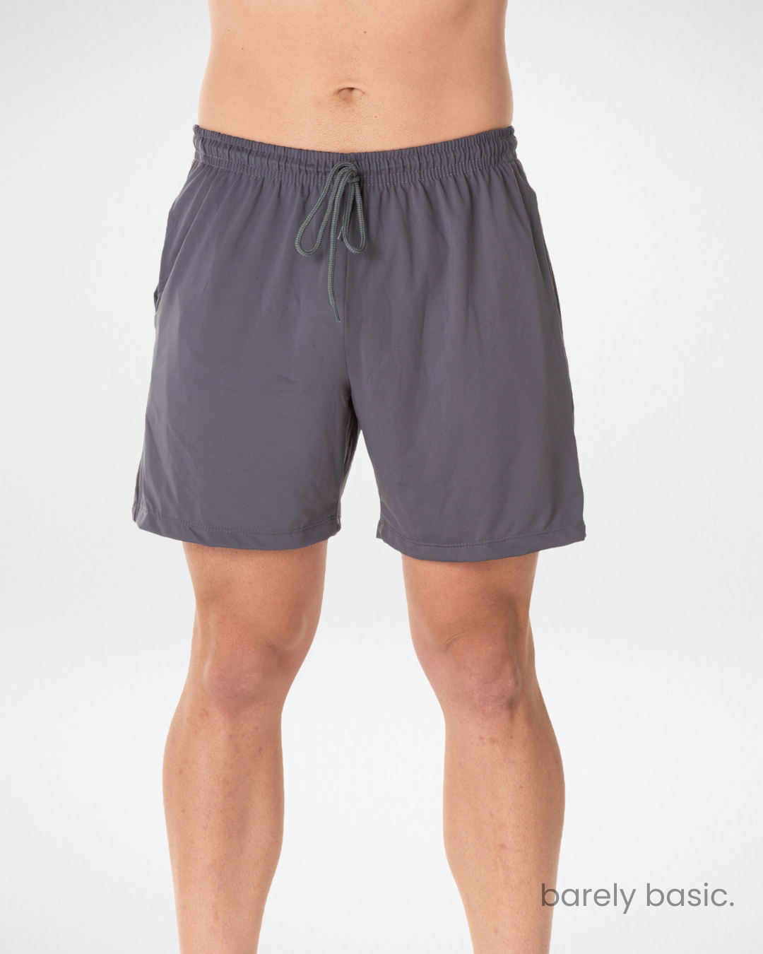 dark grey dry fit shorts for men side and front; breathable grey training shorts with relaxed fit; men’s grey athletic shorts with quick-dry technology; flexible grey shorts with drawstring waist; wrinkle-resistant men’s grey gym shorts